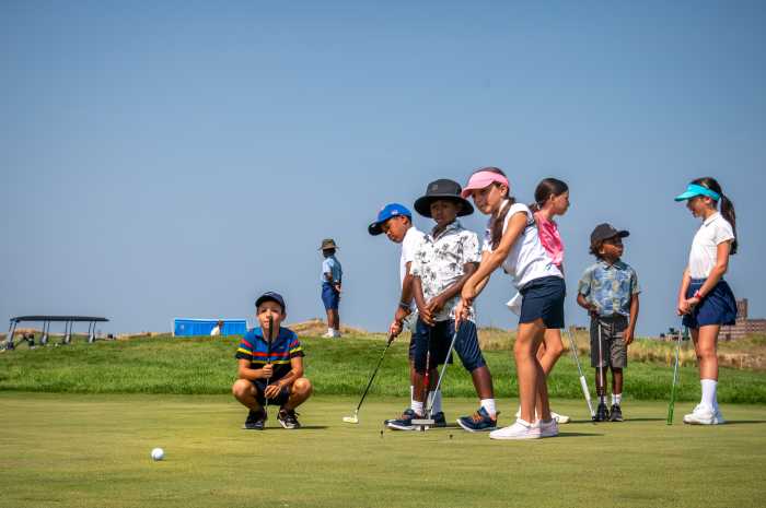 Children in the youth group from grades 1 to 6 learned how to size up a putt on the green from esteemed golf pros at Bally's Ferry Point on Monday's free Junior golf clinic.
