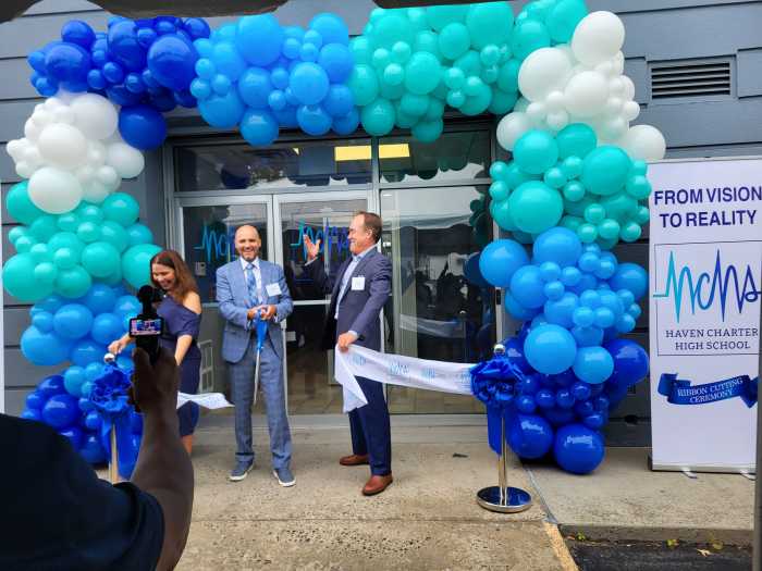 Leaders of East Side House Settlement and Haven Charter High School cut the ribbon on Aug. 20, 2025.