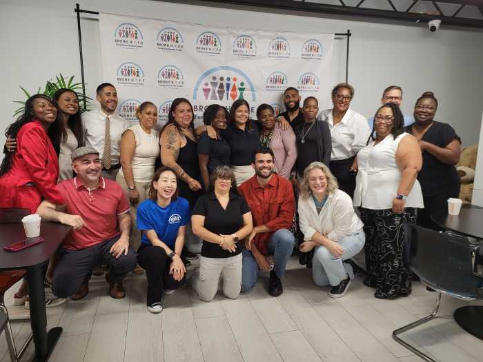 people in group photo as enrichment center wins nonprofit award