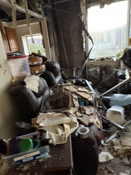The destruction penetrated up seven floors, leaving shattered glass, walls completely torn down and apartments soaked in water from FDNY's efforts to suppress the fire.