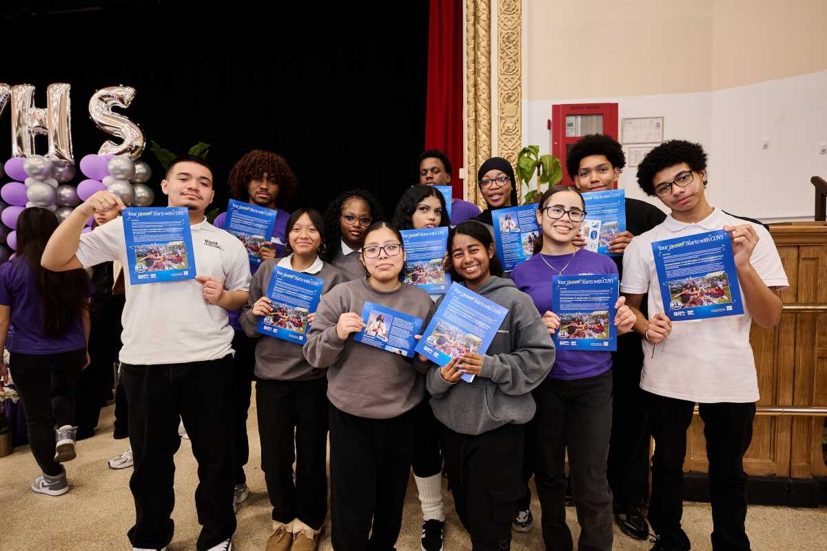 Seniors from World View High School in Kingsbridge Heights show off their "Welcome to CUNY" letters on Thursday, Oct. 23 ahead of the free college application period.