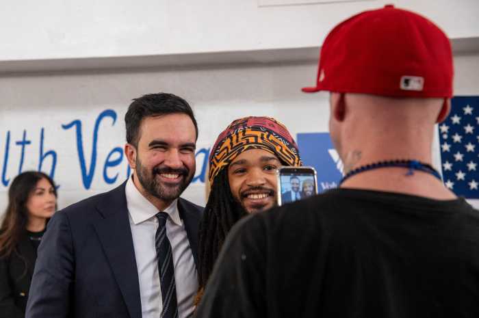 Bronx vets took turns posing for photos with mayor-elect Mamdani on veterans day at a luncheon in Parkchester where he spoke with service members about what they need from city government.