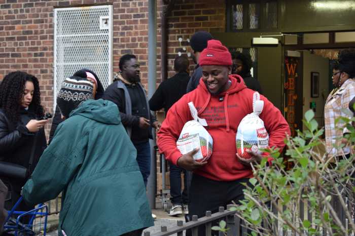 Kevin Riley handing out turkeys at Parkside Senior Center (1)