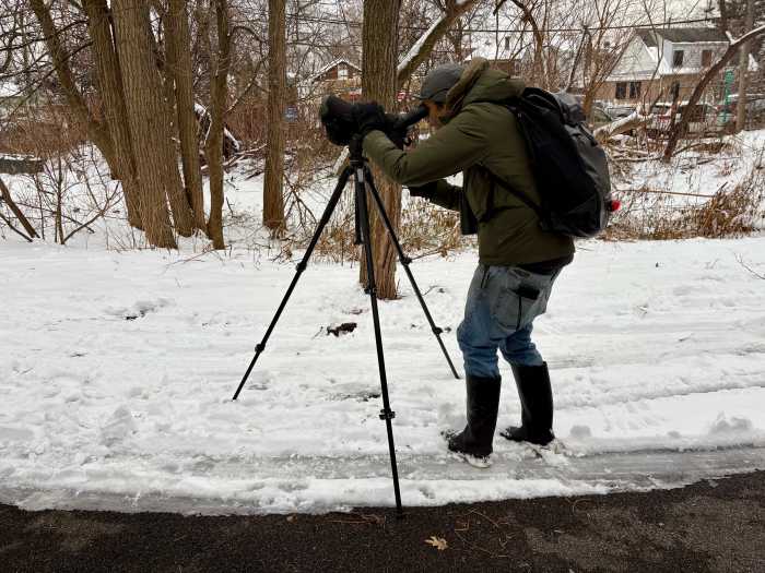 Richard Aracil looked through a scope with a magnification capable of seeing up to 1,000 years, or 10 football fields, away to view birds a Pugsley Creek during the NYC Christmas Bird Count in the Bronx.