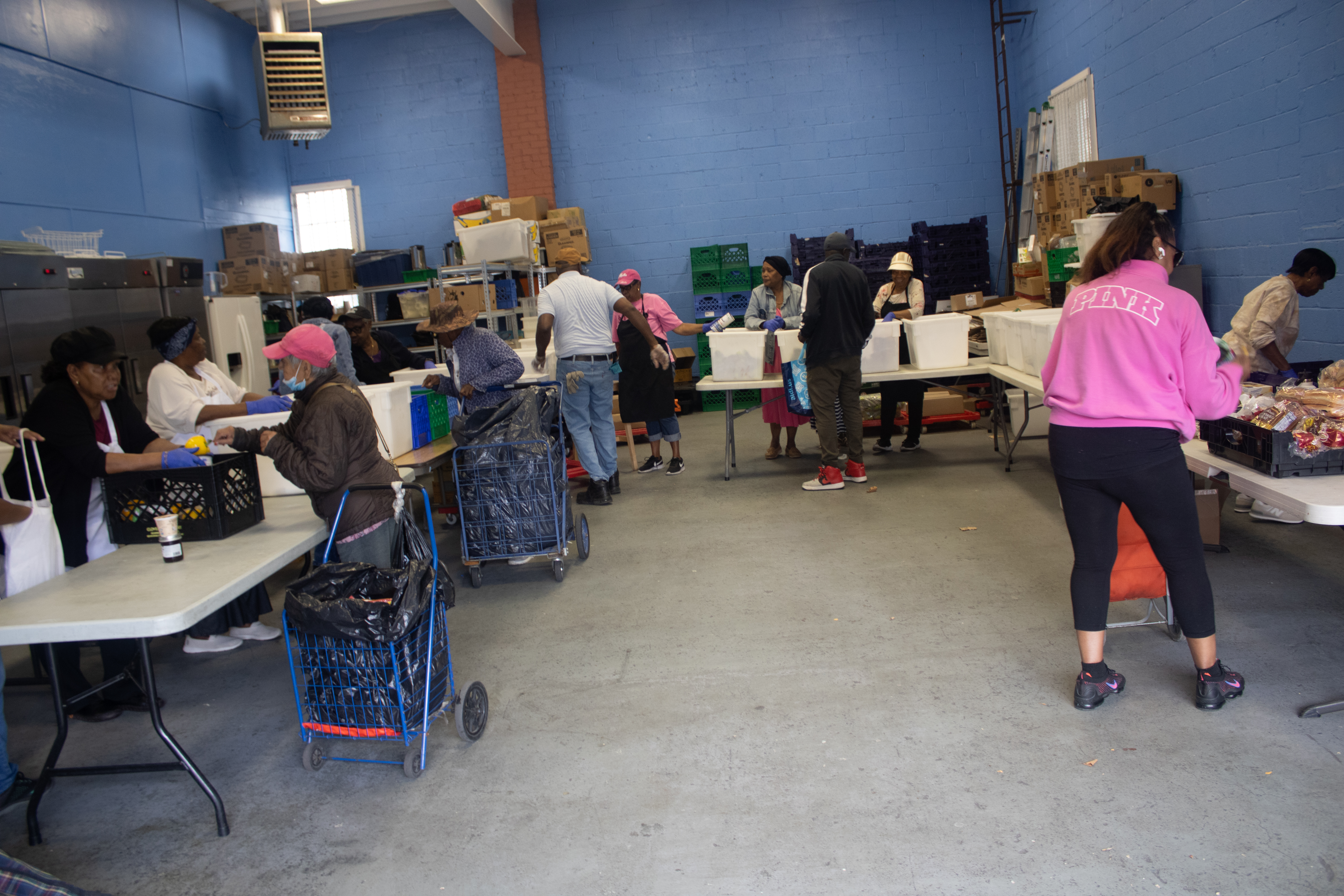 Volunteers distributing groceries at a Bronx food aid event.