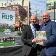 Third Avenue BID executive director Pedro Suarez and Department of Small Businesses commissioner Kenny Minaya in Roberto Clemente Plaza with the results of the Commercial District Needs Assessment.