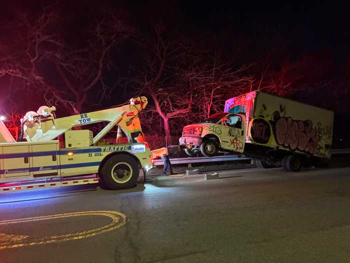The heavy-duty tow truck removed a tractor-trailor off of the Throgs Neck Expressway service road.