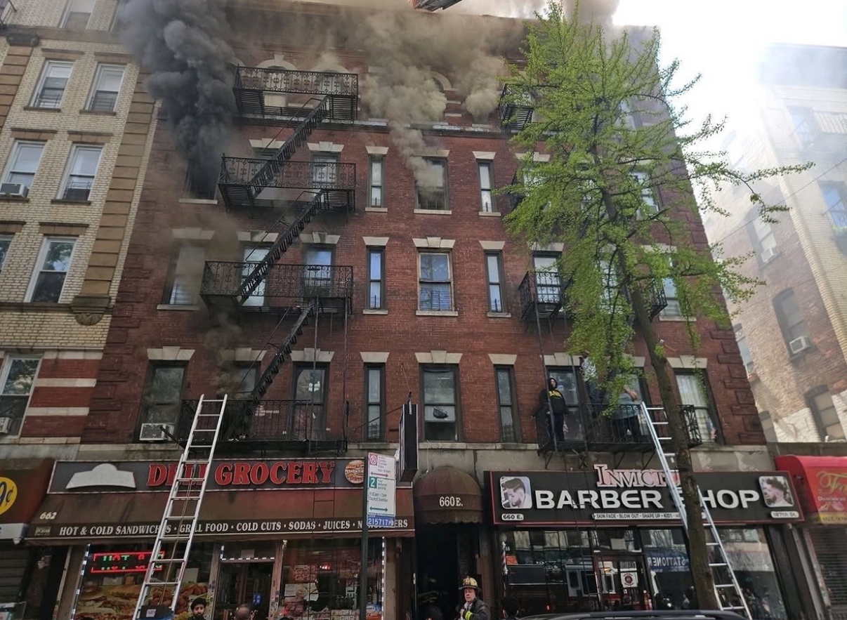 A five-alarm fire blazes through storefronts and apartments on 660 E 187th Street in the Bronx's Little Italy.