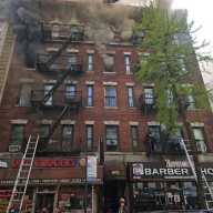 A five-alarm fire blazes through storefronts and apartments on 660 E 187th Street in the Bronx's Little Italy.