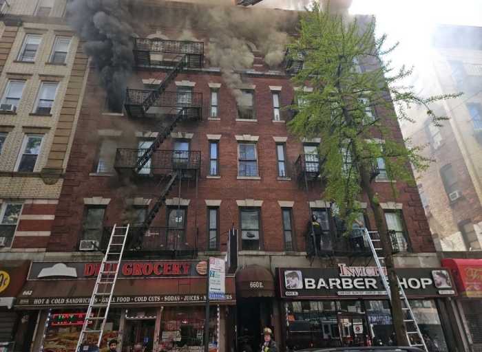 A five-alarm fire blazes through storefronts and apartments on 660 E 187th Street in the Bronx's Little Italy.