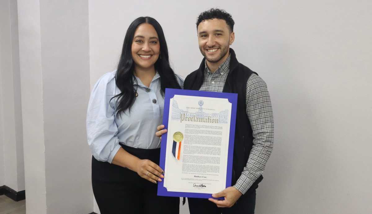 Bronx Community Board 10 District Manager Matt Cruz receives proclamations from Council Member Amanda Farías