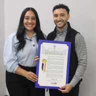 Bronx Community Board 10 District Manager Matt Cruz receives proclamations from Council Member Amanda Farías