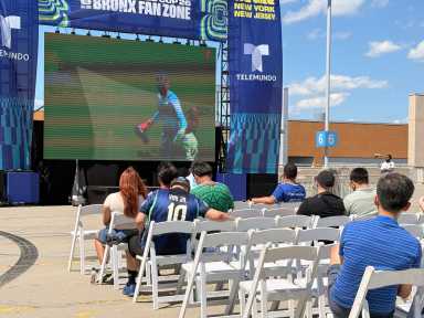 Several Bronx fans watch Qatar take on Switzerland during the FIFA World Cup on Saturday, June 14, while even more fans watch from a shaded tent nearby while beating the heat.