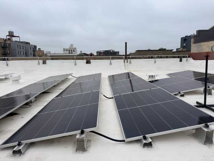 Solar panels atop 2676 Grand Concourse, one of the buildings participating in Fieldston Power's community distributed solar network.