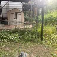 The fencing in Cliff Muniz's backyard is sinking along with the soil in his backyard. As HOA president, Muniz has led the effort to start repairs for the Villa Maria homeowners.