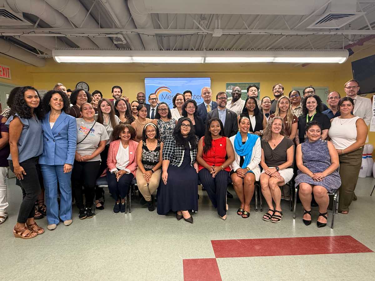 Assemblymember Amanda Septimo and Senator Luis Sepulveda pose with nonprofit and community leaders that make up the statewide LUCHA coalition.