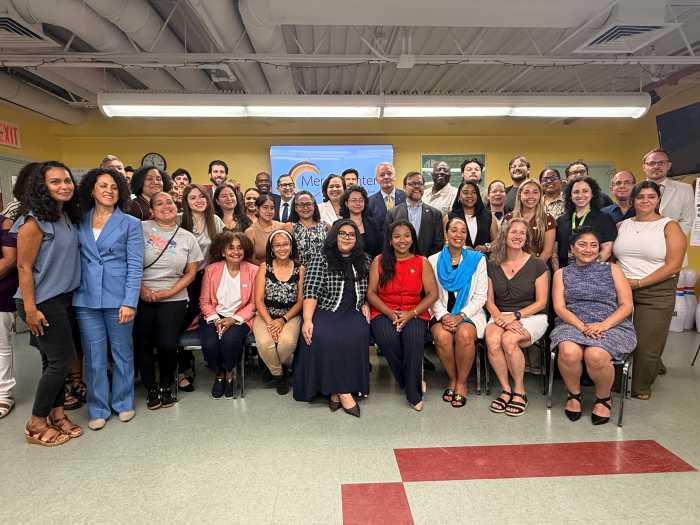 Assemblymember Amanda Septimo and Senator Luis Sepulveda pose with nonprofit and community leaders that make up the statewide LUCHA coalition.
