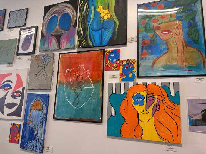 Daisy's Juice Bar and Café expanding next door to open dining space for customers. Here, customers drink, eat, and work. Local artists display their work at Daisy's without a commission fee.