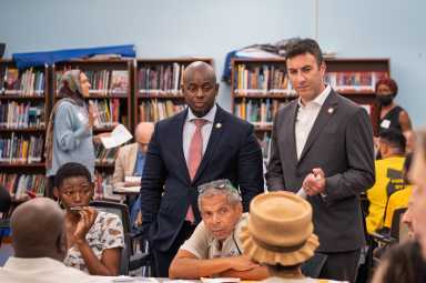 Councilmembers Kevin Riley and Eric Dinowitz listen in on community members concerns and hopes for White Plains Road.