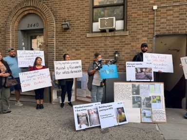 Tenants at 2440 Walton Ave hold a rally ahead of their next court date, where they are seeking a court-appointed administrator to take over their building.