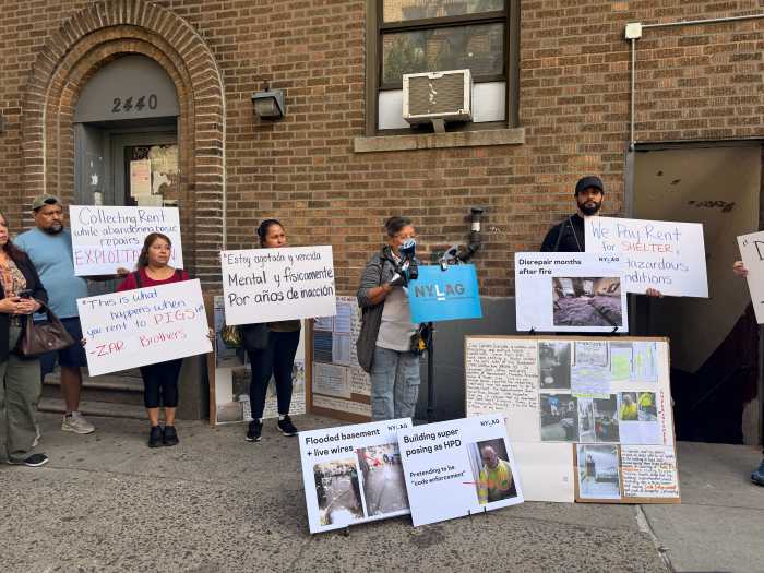Tenants at 2440 Walton Ave hold a rally ahead of their next court date, where they are seeking a court-appointed administrator to take over their building.