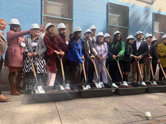 Elected officials, agency representatives, and community members break ground on the $44 million construction of the HEArts Center.