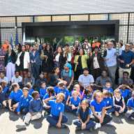 Elected officials, development partners, and community members celebrate the re-opening of the St. Mary's Recreation Center.