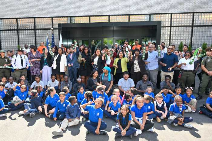 Elected officials, development partners, and community members celebrate the re-opening of the St. Mary's Recreation Center.
